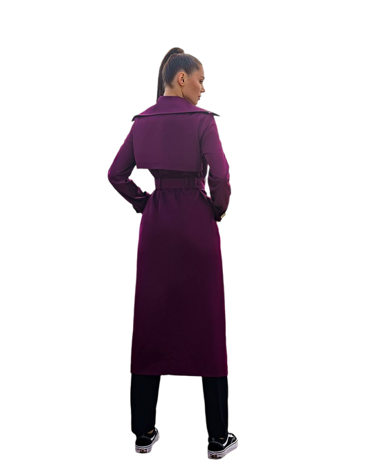 Person wearing a long purple coat on a white background