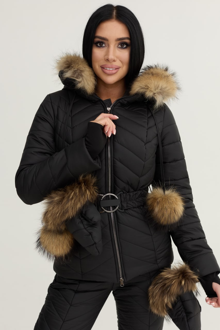 Woman wearing a black puffer jacket with fur trim on a white background