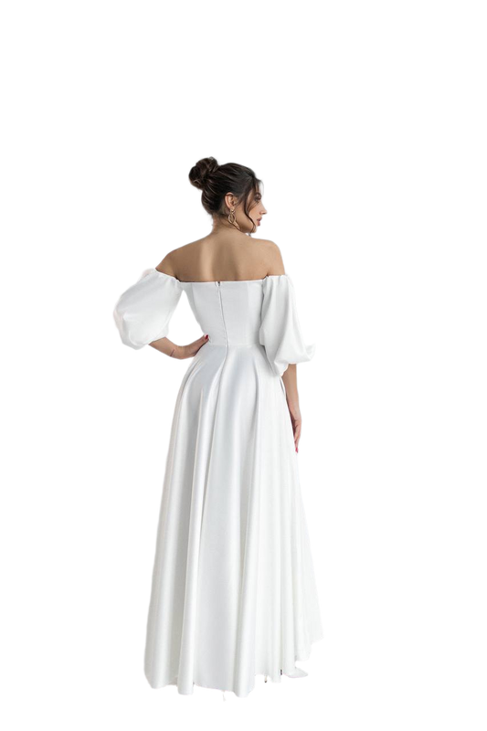 Woman wearing a white off-shoulder dress on a white background