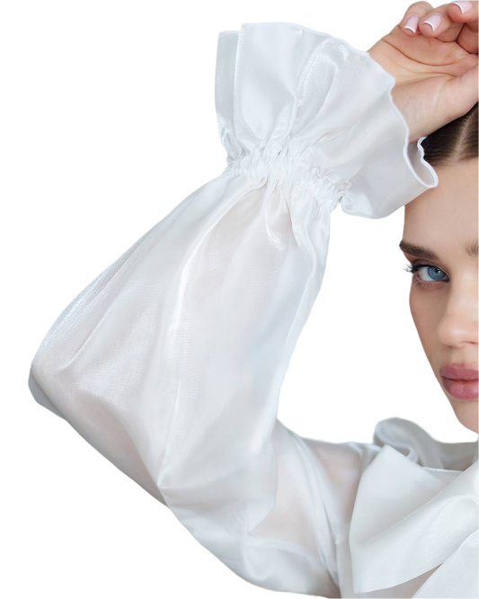 White arm sleeve being worn by a person on a white background