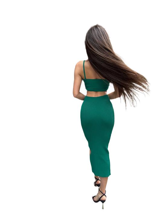 Woman in a green dress with long hair on a white background