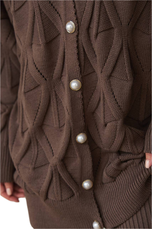 Brown knitted cardigan with pearl buttons on a white background