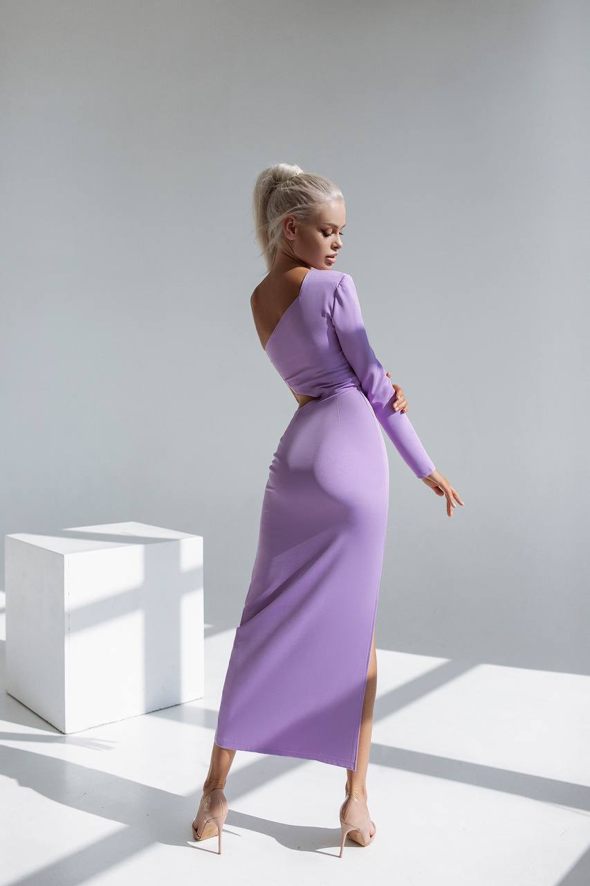 Woman wearing a purple dress in a minimalistic setting