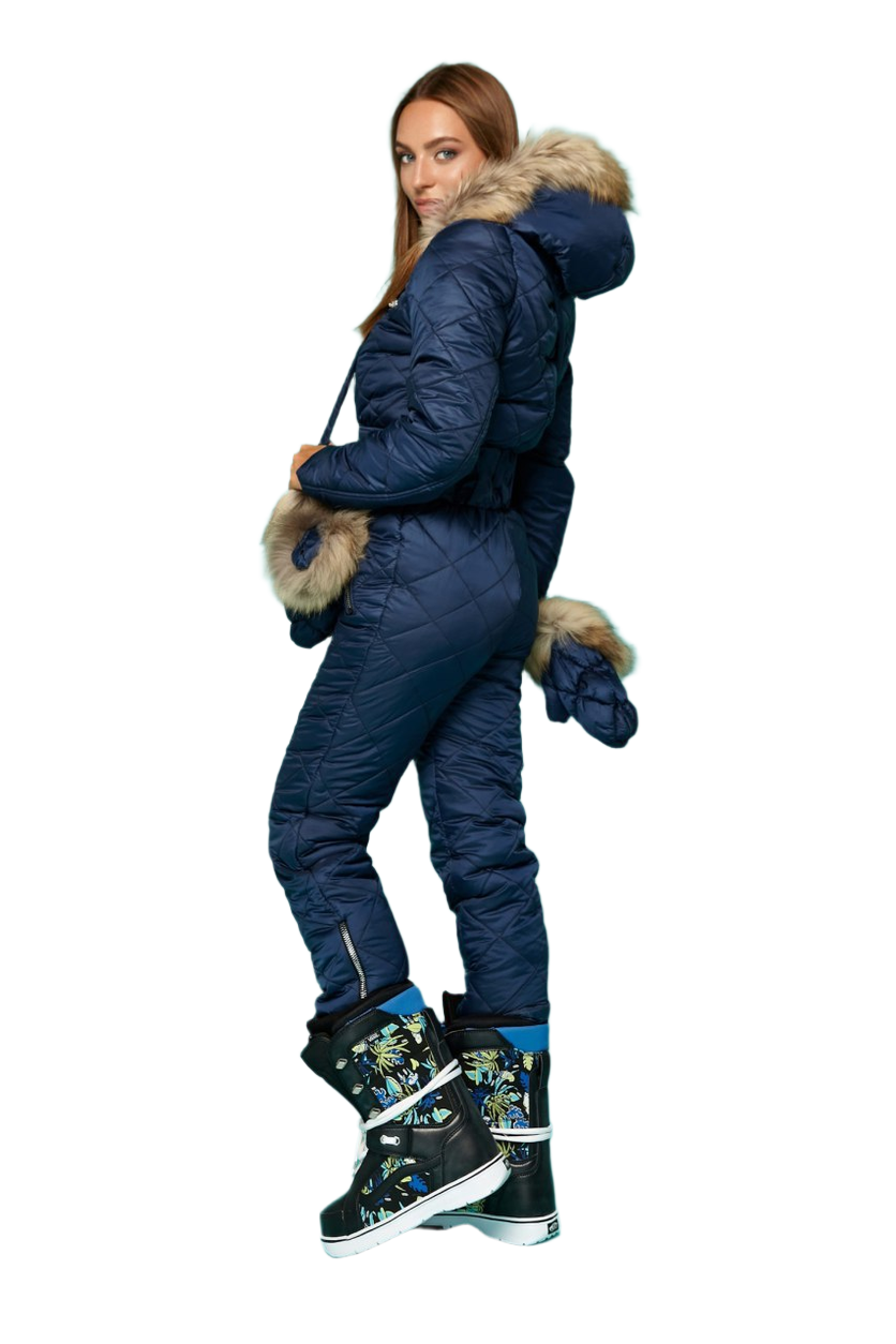 Person wearing a blue snowsuit with fur trim on a white background