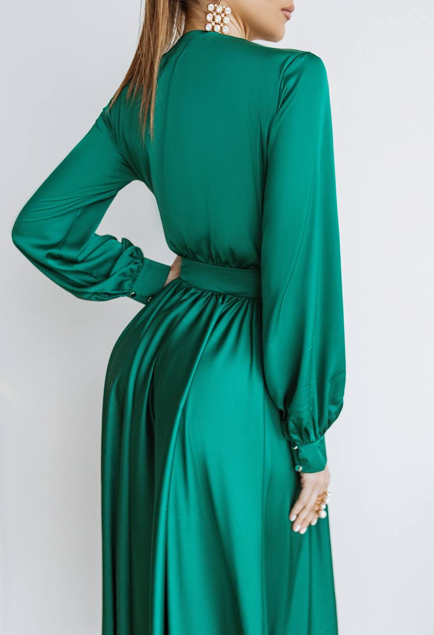 Green dress with long sleeves on a white background