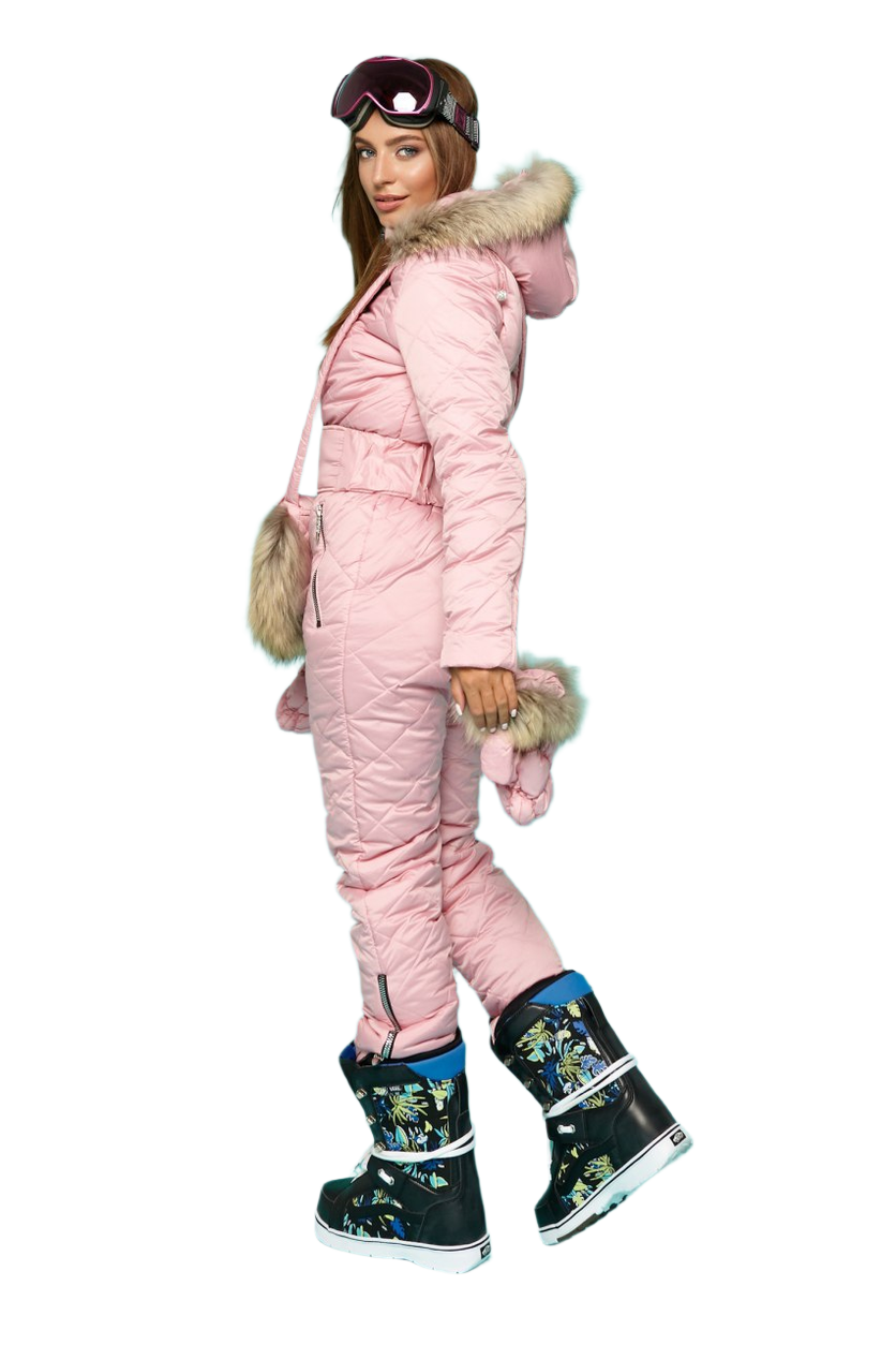 Person wearing a pink puffer snowsuit with fur hood and floral boots on a white background