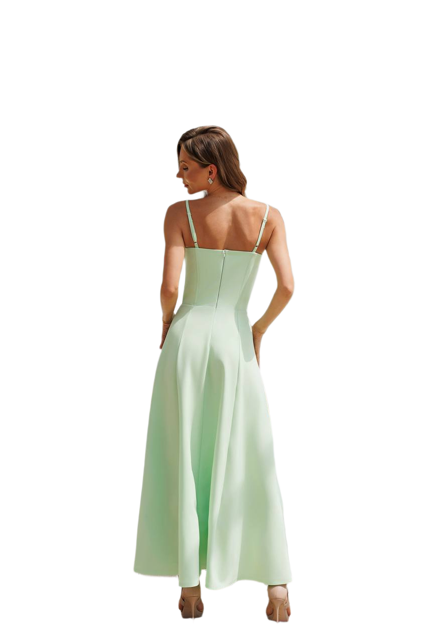 Woman wearing a light green dress on a white background
