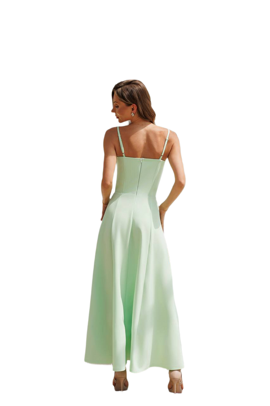 Woman wearing a light green dress on a white background