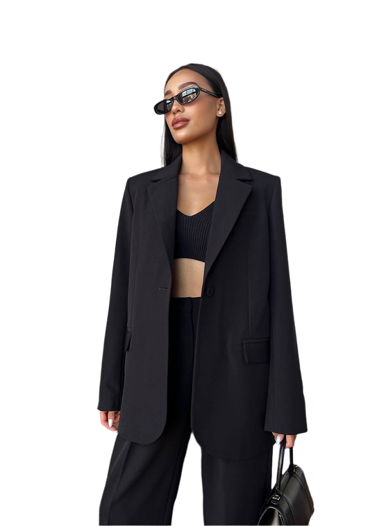 Woman wearing a black suit with sunglasses on a white background