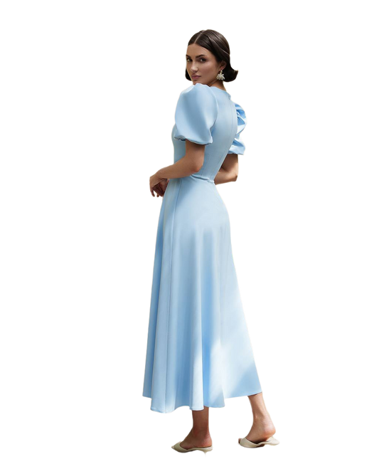 Woman wearing a light blue dress on a white background