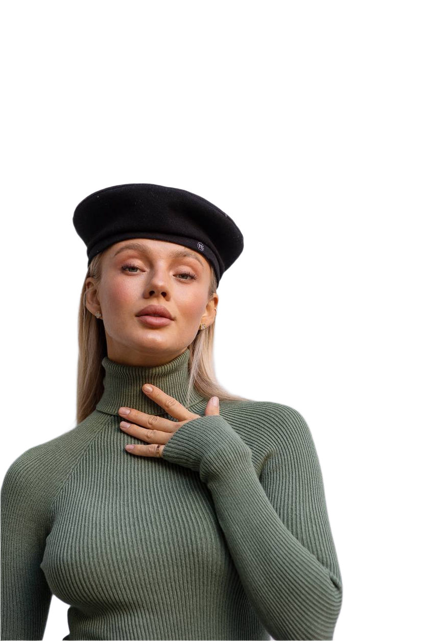 Woman wearing a green turtleneck sweater and black beret on a white background