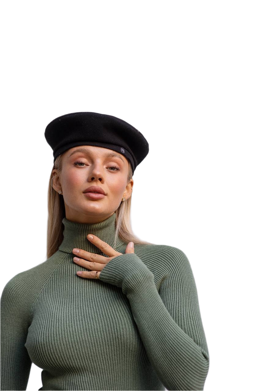 Woman wearing a green turtleneck sweater and black beret on a white background