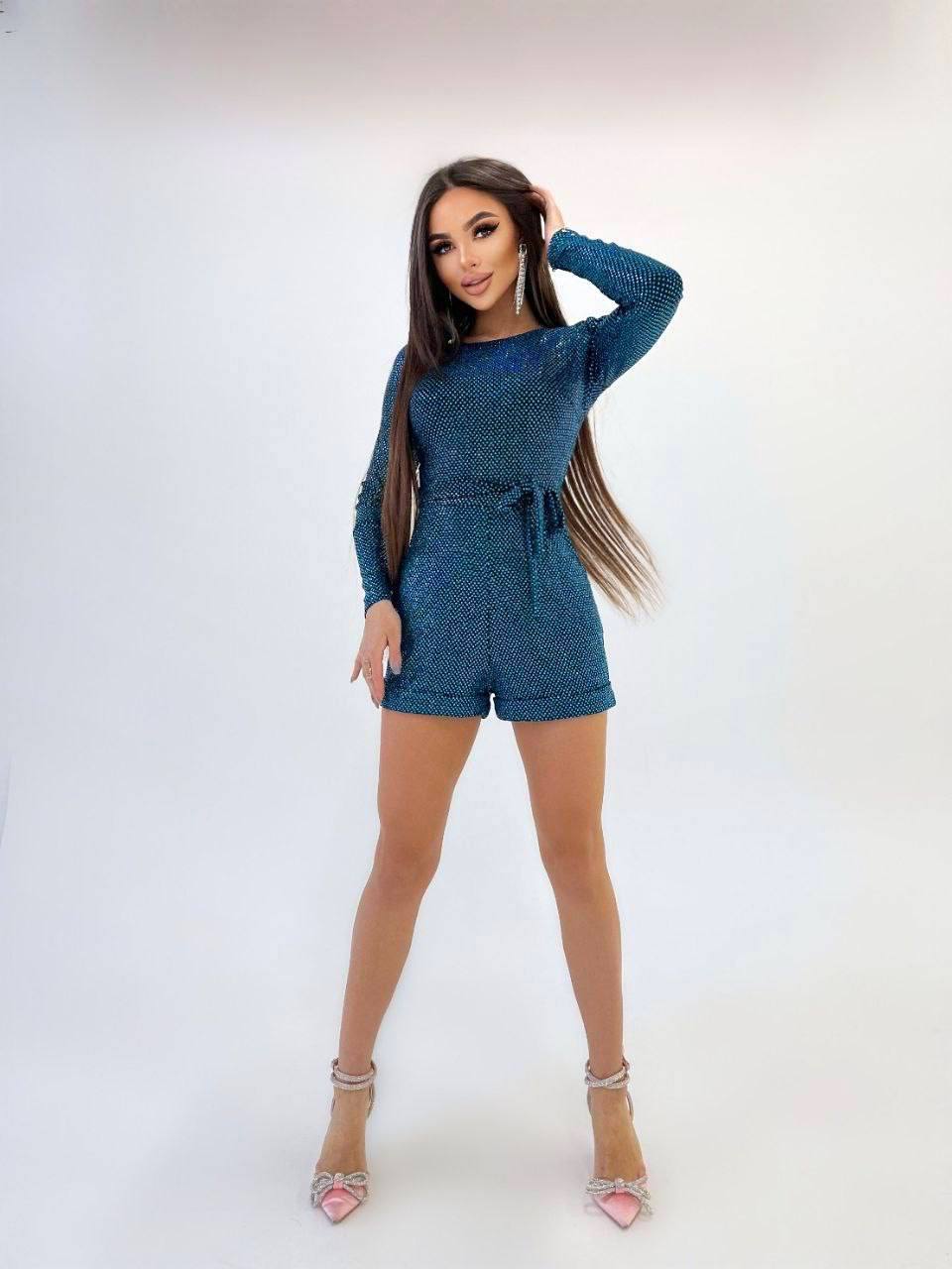 Woman wearing a blue outfit on a white background