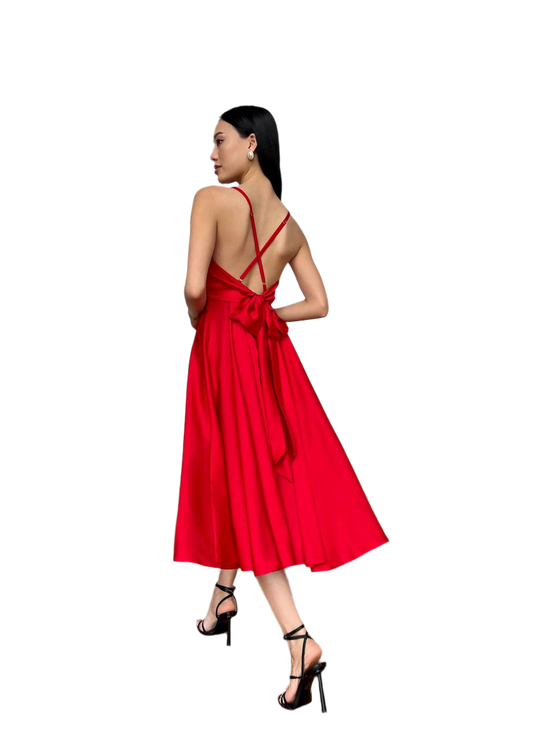 Red dress with a bow detail on a white background