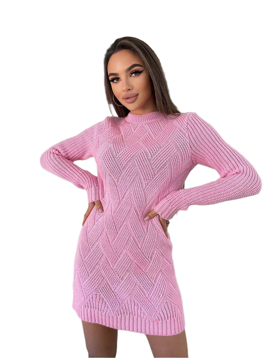 Woman wearing a pink knitted dress on a white background