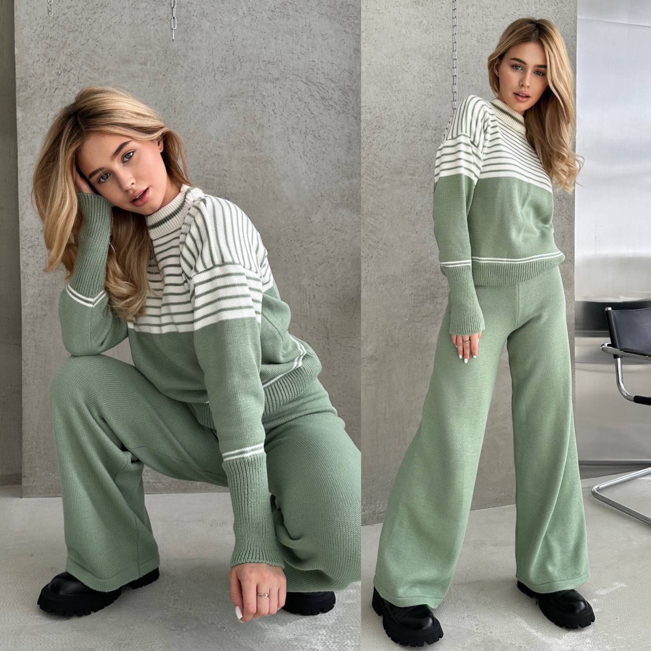 Woman wearing a green and white striped sweater and pants in an indoor setting.