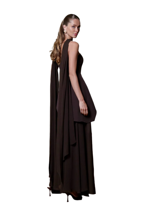 Woman wearing a dark brown evening gown on a white background