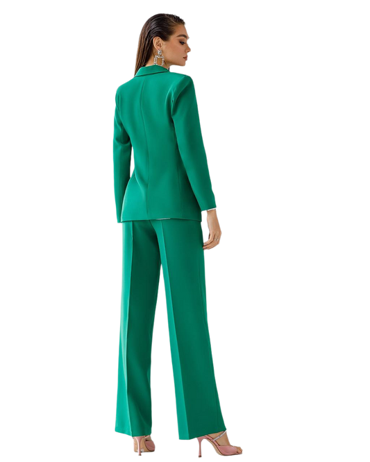 Woman wearing a green suit on a white background