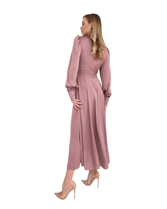 Woman wearing a pink dress on a white background