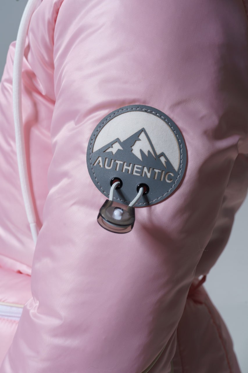 Pink jacket with 'Authentic' mountain logo patch on sleeve