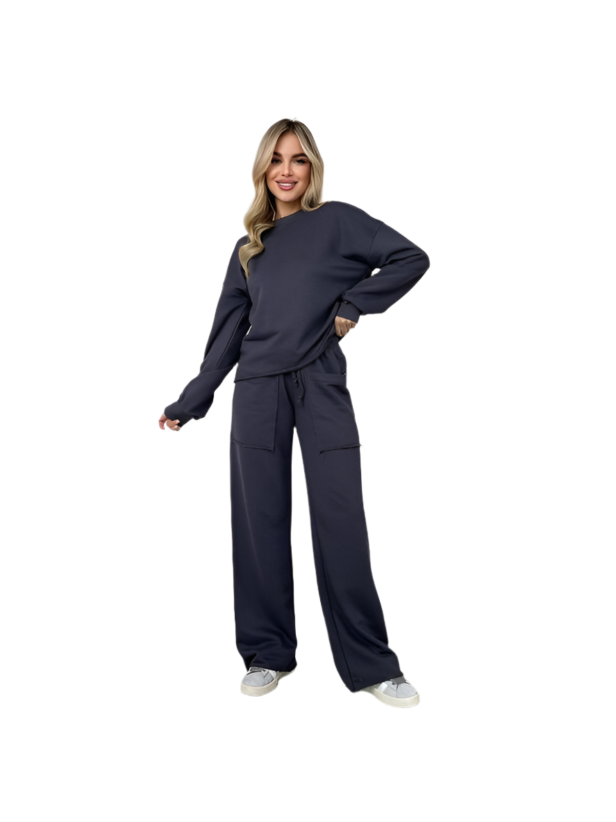 Woman wearing a navy blue tracksuit on a white background