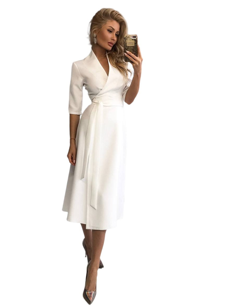 Woman in a white dress taking a selfie on a white background