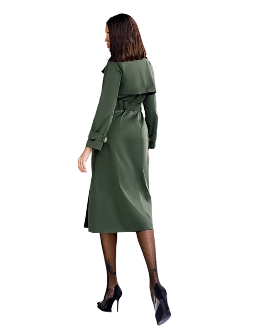Woman wearing a green trench coat on a white background