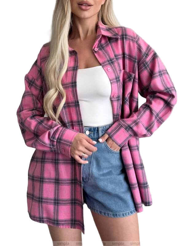 Woman wearing a pink plaid shirt over a white top and denim skirt on a white background