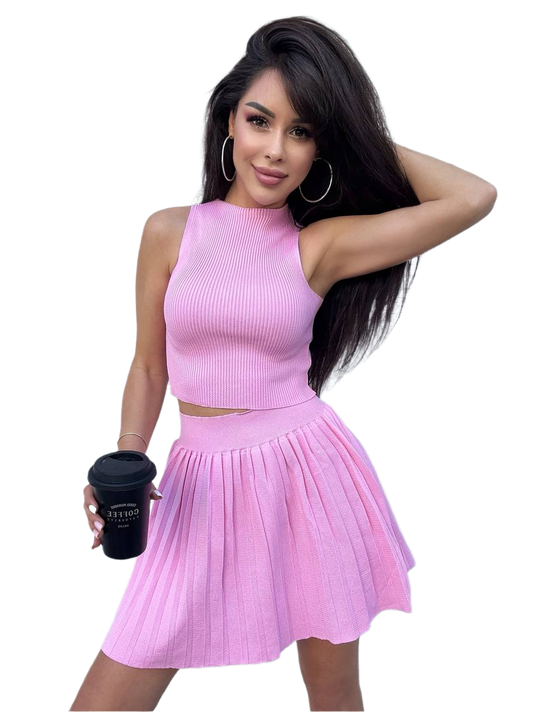 Woman wearing a pink outfit holding a black cup on a white background