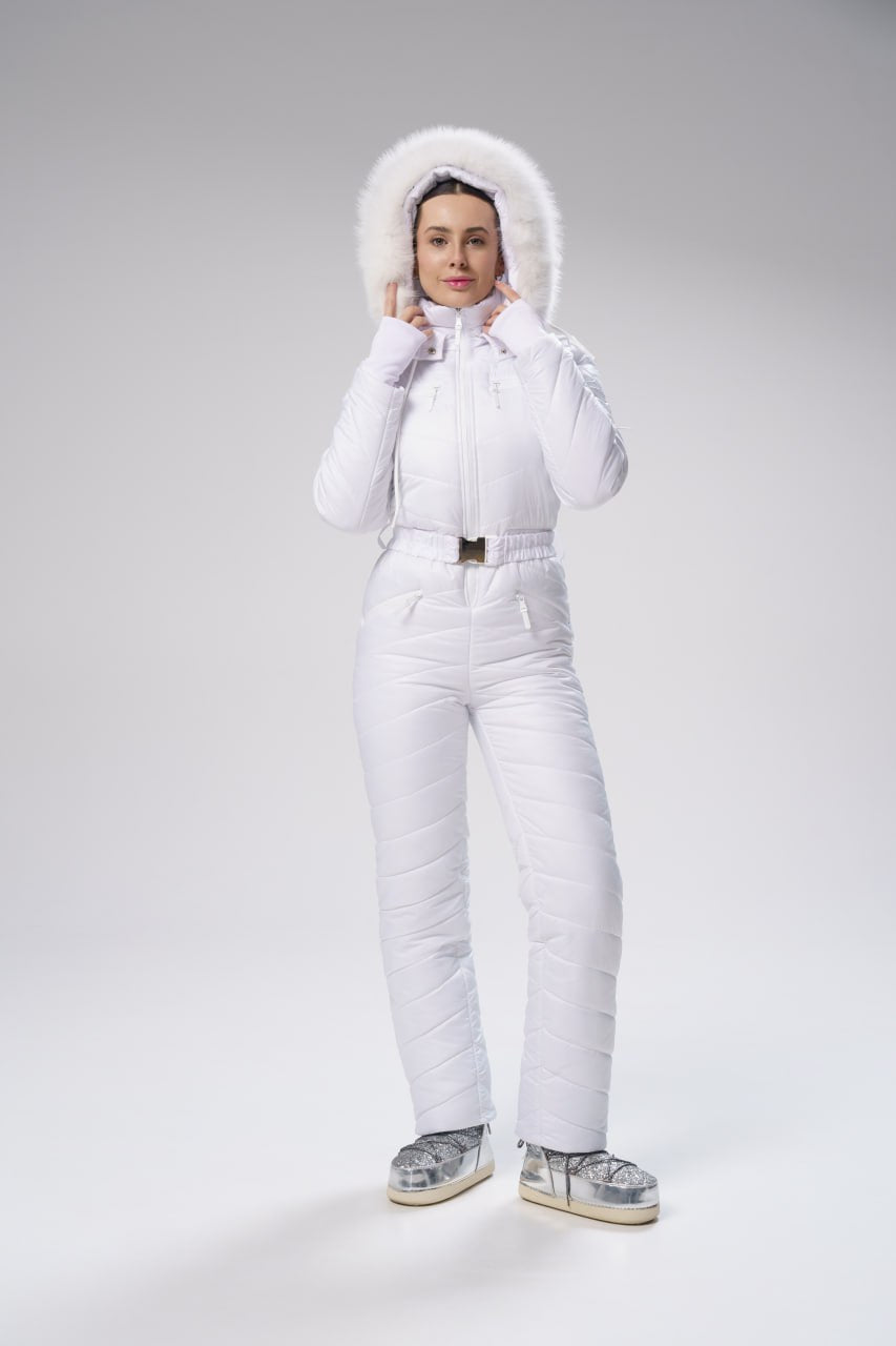Person wearing a white puffer suit on a gray background