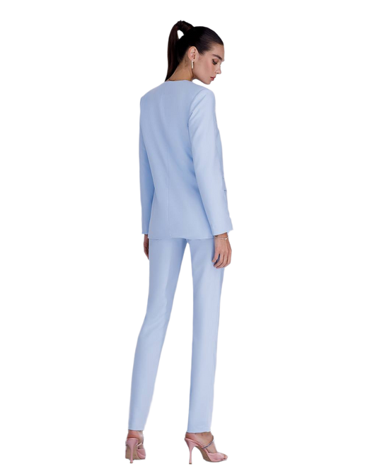 Woman wearing a light blue suit on a white background