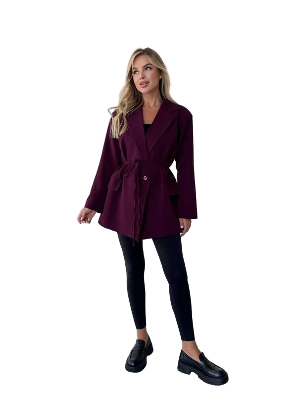 Woman wearing a burgundy coat on a white background