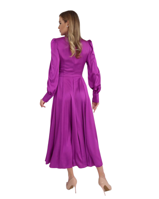 Purple dress worn by a model on a white background