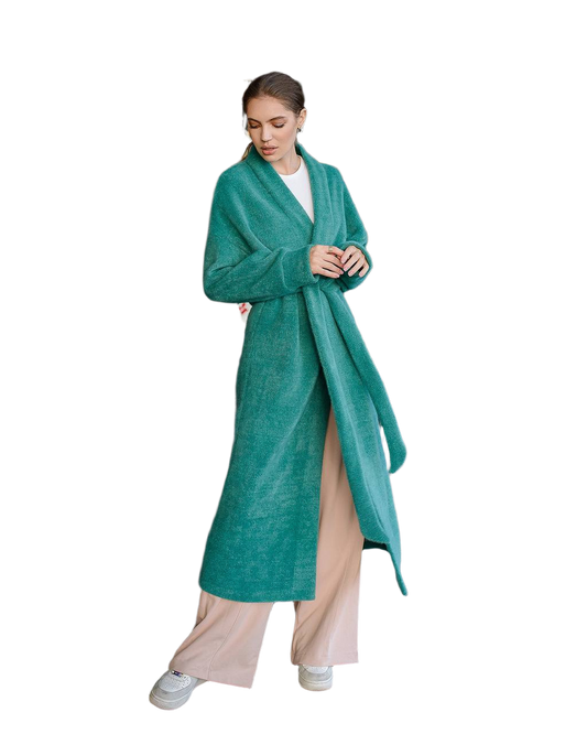 Woman wearing a teal robe on a white background