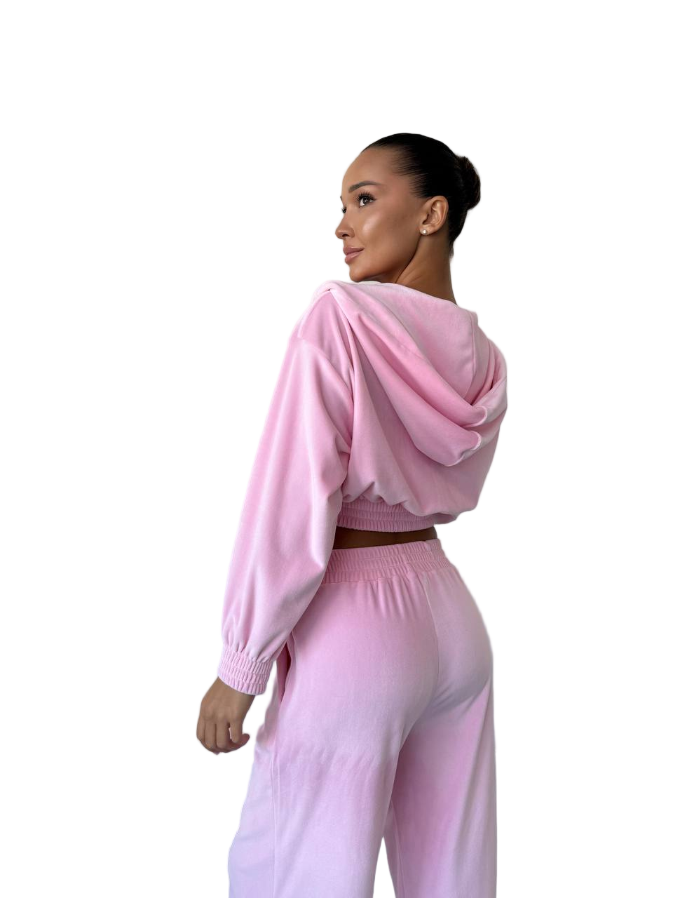 Woman wearing a pink outfit on a white background
