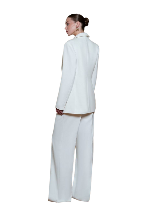 Person wearing a white suit on a white background