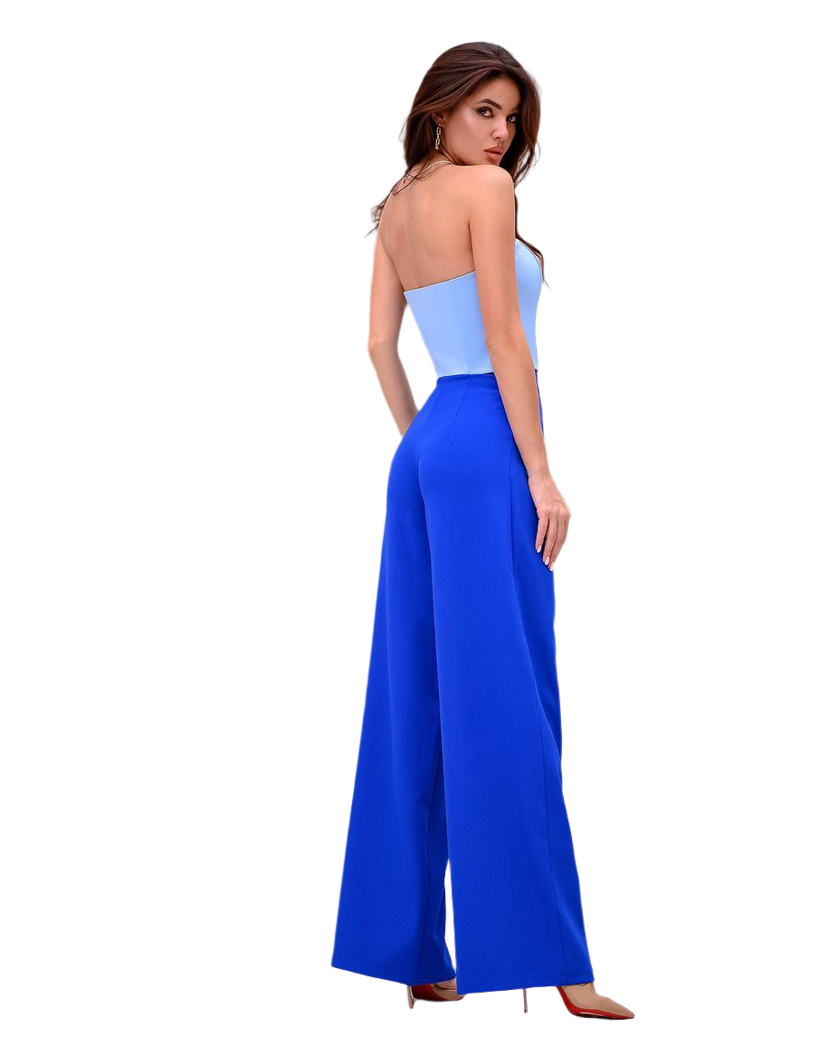 Woman wearing a blue and light blue strapless jumpsuit on a white background