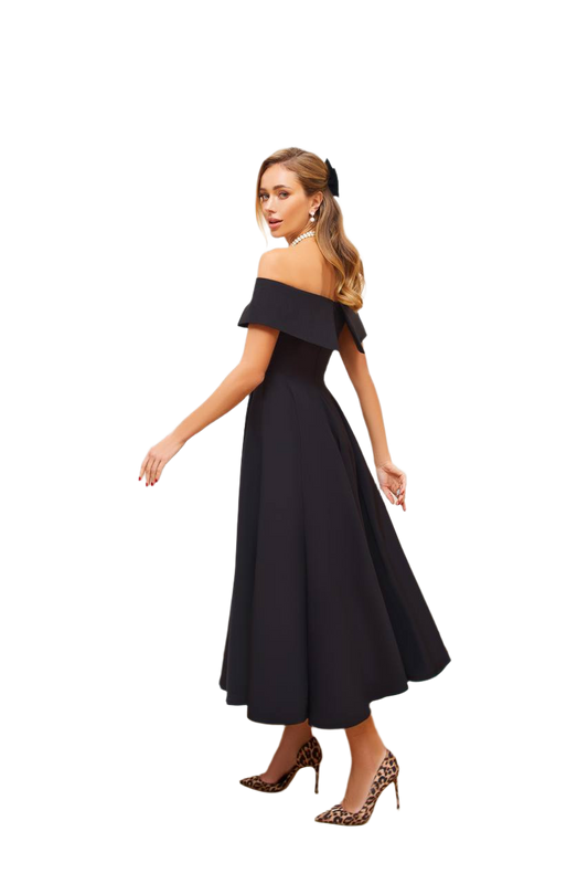 Woman wearing a black off-shoulder dress on a white background