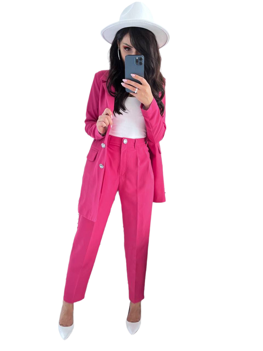 Person wearing a bright pink outfit with a white hat on a white background