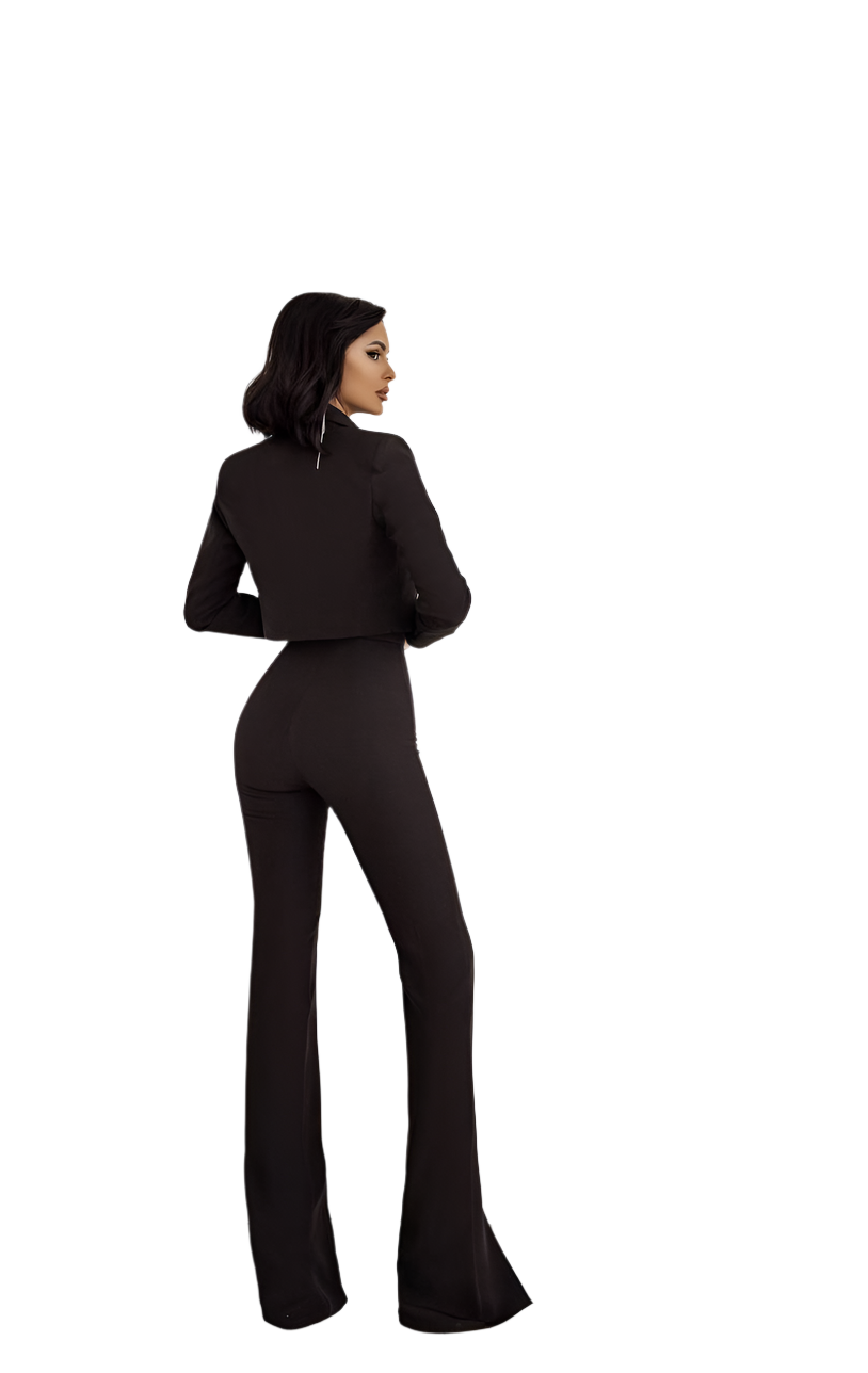 Woman wearing a black outfit with flared pants on a white background