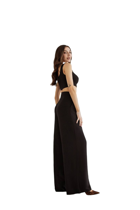 Woman wearing a black dress on a white background