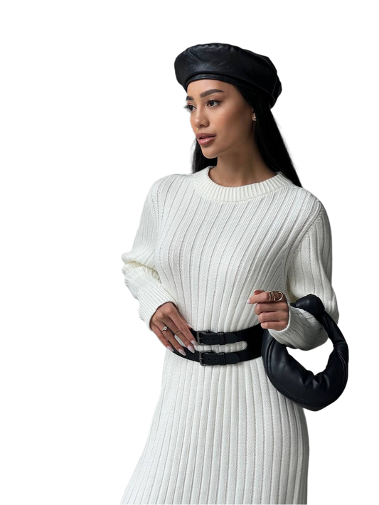 Woman wearing a white ribbed sweater and black headscarf on a white background