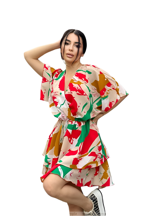 Woman wearing a colorful floral dress on a white background