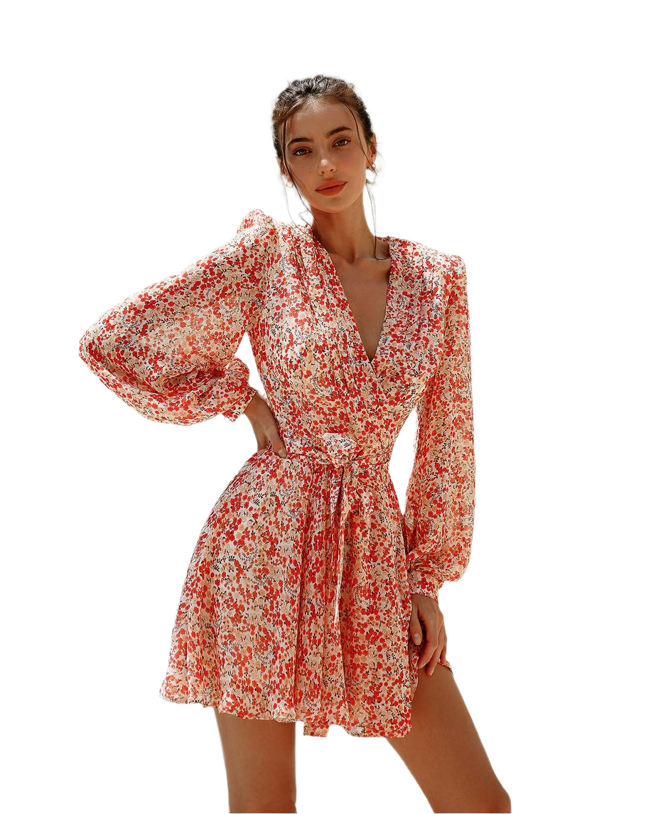 Woman wearing a red and white floral dress on a white background