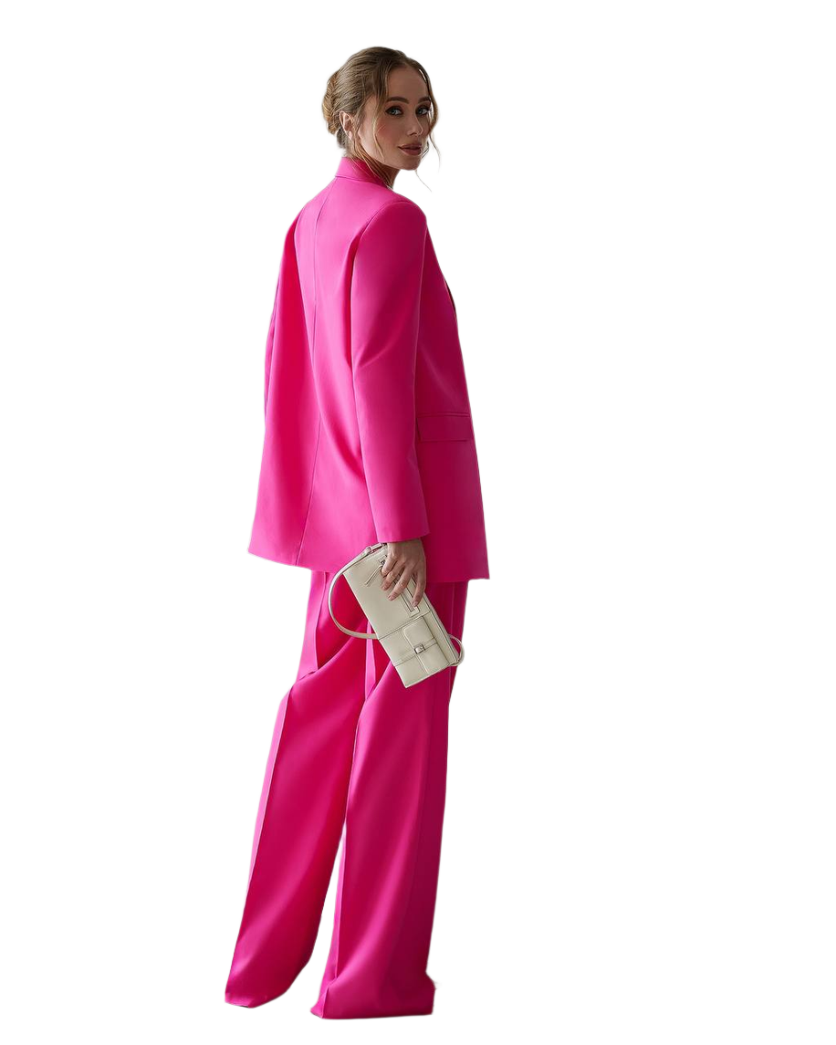Woman wearing a bright pink outfit on a white background