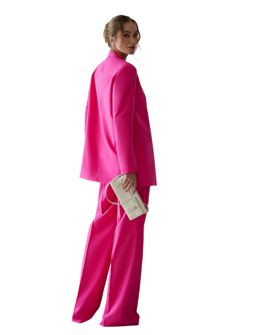 Woman wearing a bright pink outfit on a white background