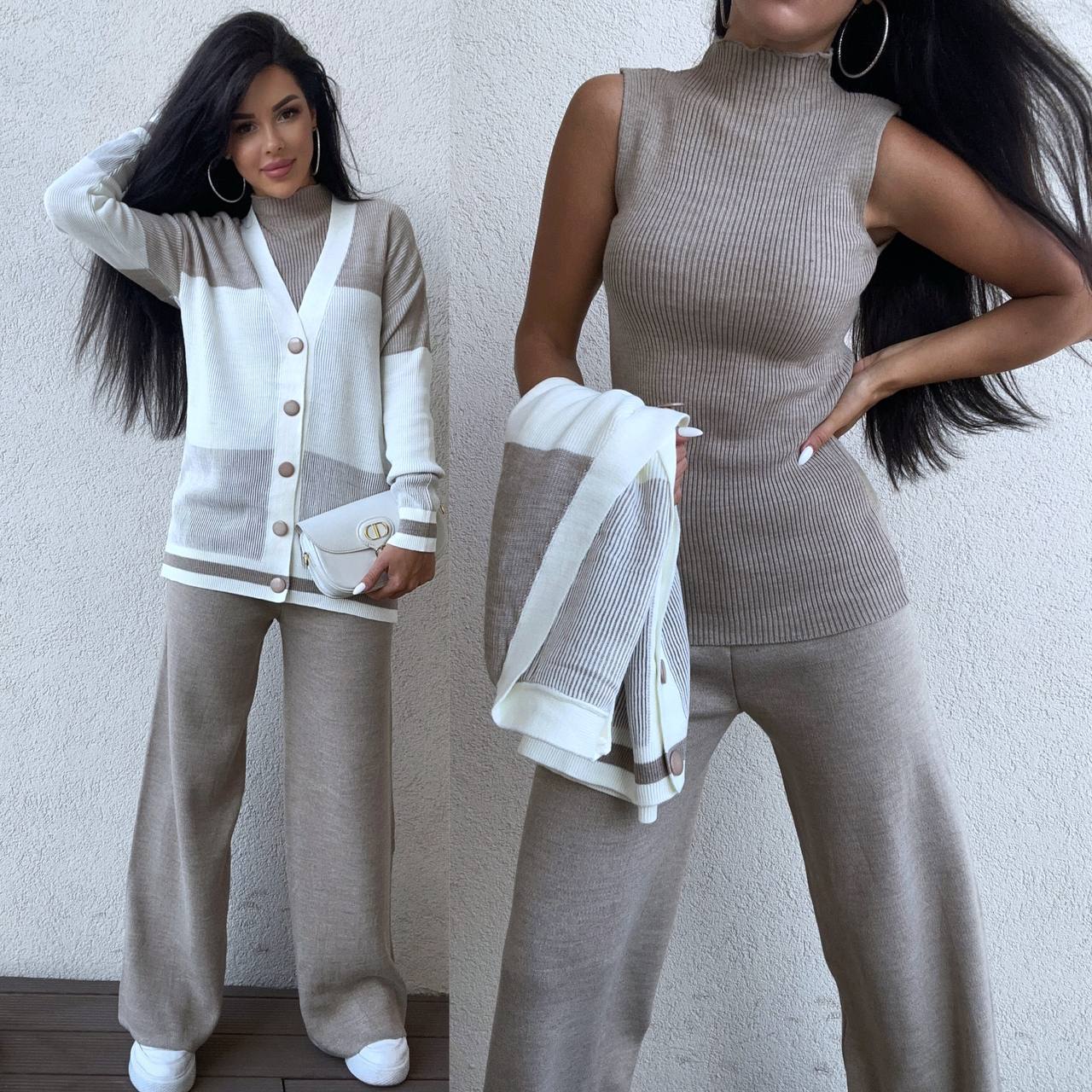 Woman wearing a beige and white outfit with a matching cardigan and pants against a plain background.