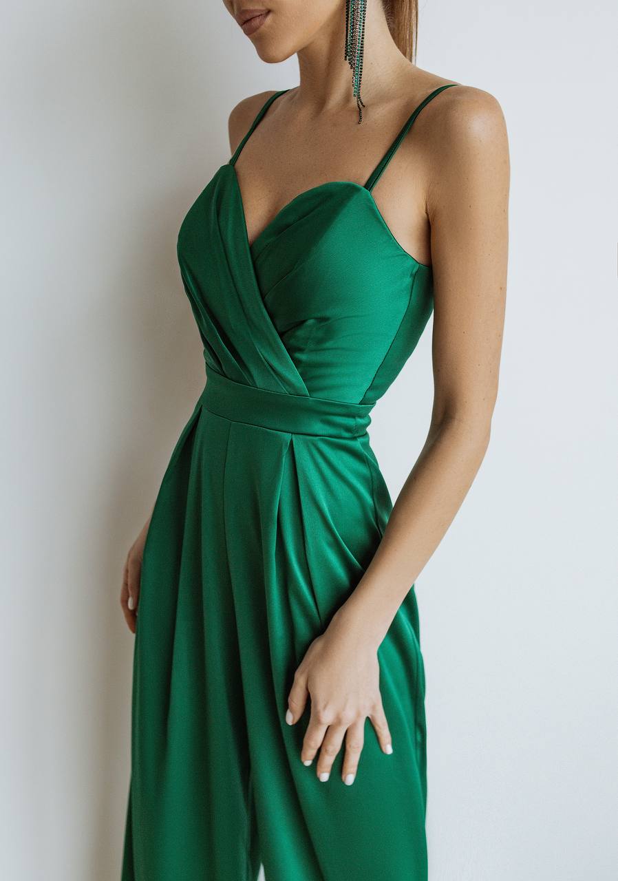 Woman wearing a green dress against a white background