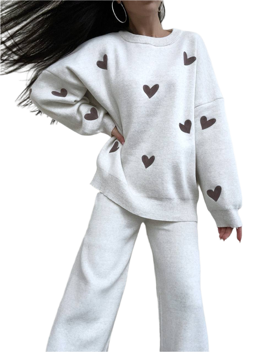White outfit with heart patterns on a plain background