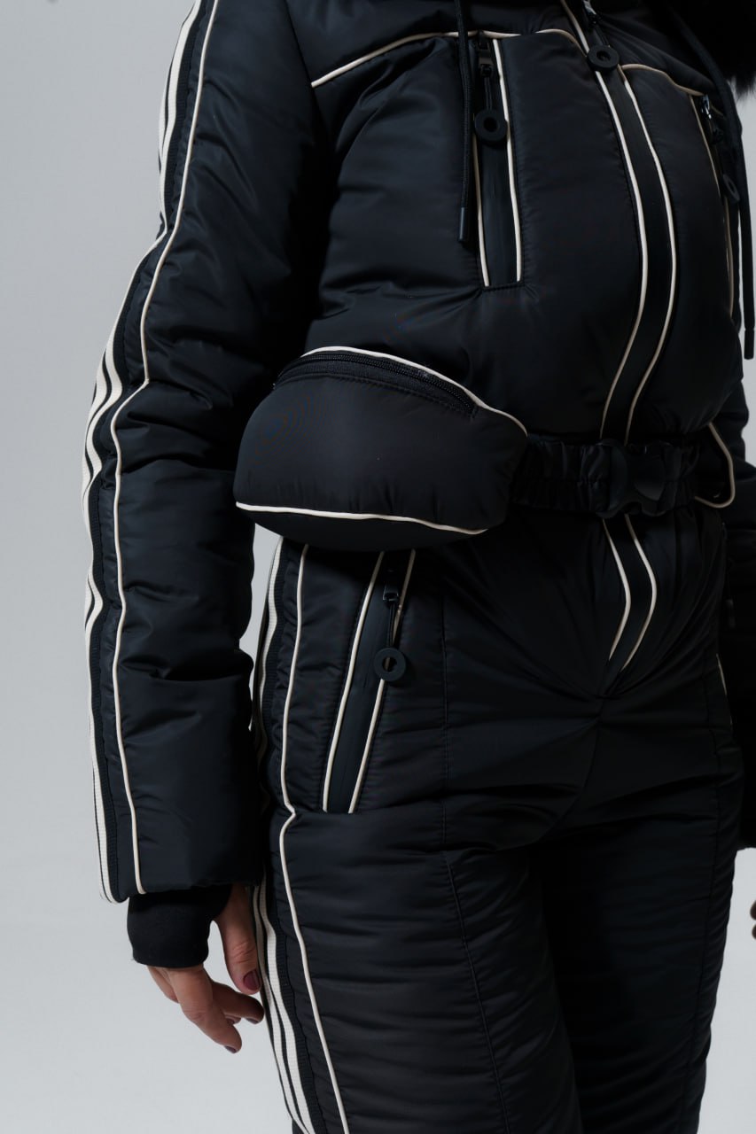 Black winter jacket with white accents on a gray background